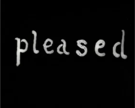 pleased the word 'pleased' in a white font on a black background